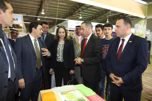 Industry, Trade and Supply Minister Maha Ali (centre) looks at a product of a firm exhibiting at the 6th Jordan International Exhibition for Chemical Industries on Tuesday (Petra photo)